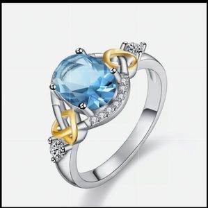 New Aquamarine Two Tone Eternity Knot Silver Ring.